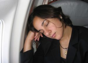 woman asleep on plane