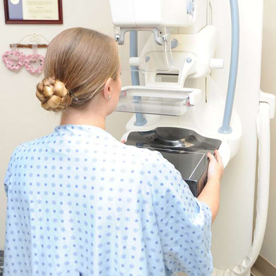 Woman getting a mammogram - breast cancer awareness